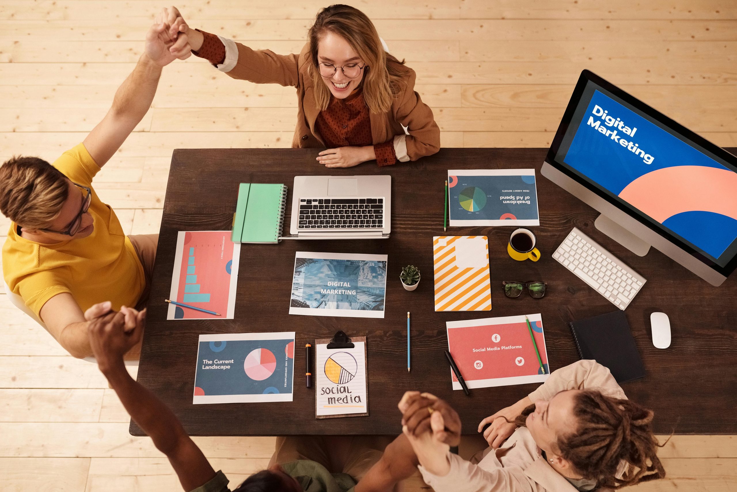 About Colleagues celebrating success in a modern digital marketing office with teamwork and collaboration.